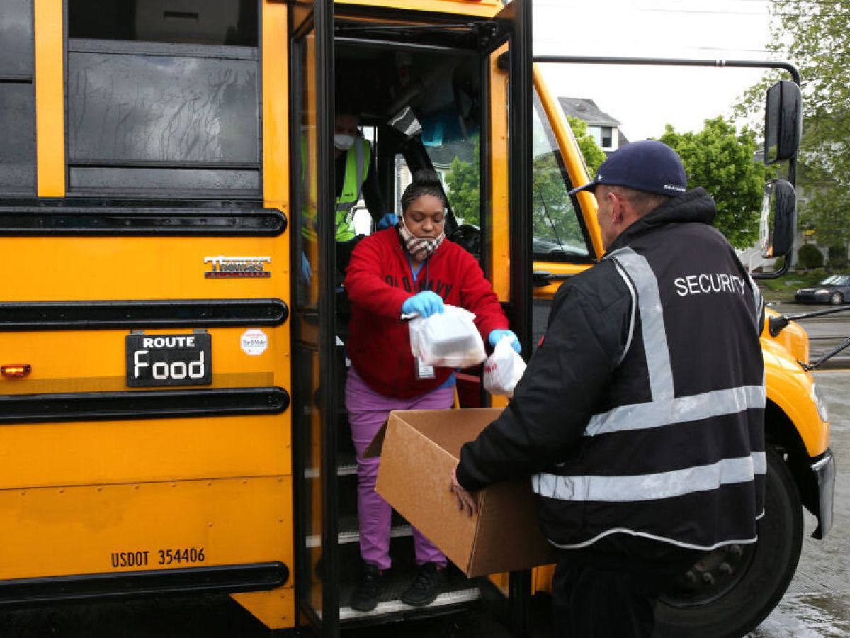 A bus driver delivering meals to children and their families