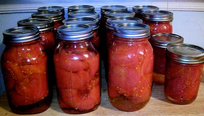 quart ball jars filled with tomatoes