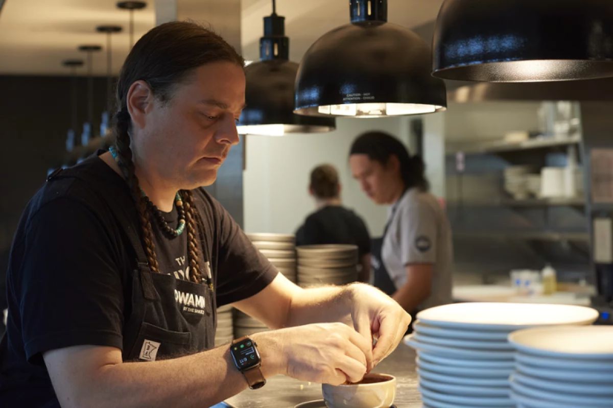 Sean Sherman preparing a dish