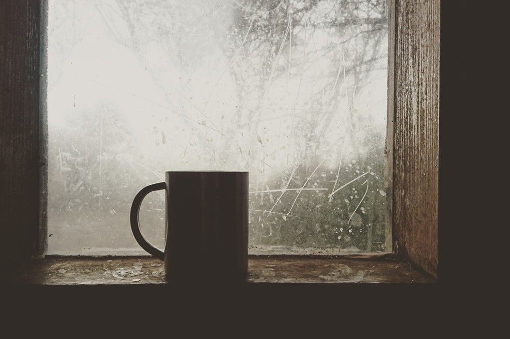 Coffee mug on a winter windowsill.