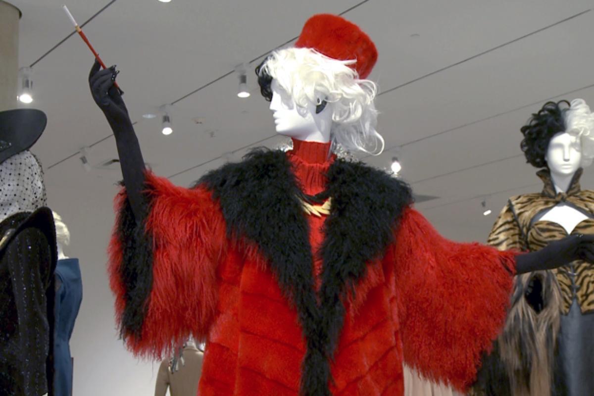 The exhibition features many of Cruella de Vil's iconic costumes from "101 Dalmatians" and "102 Dalmatians."