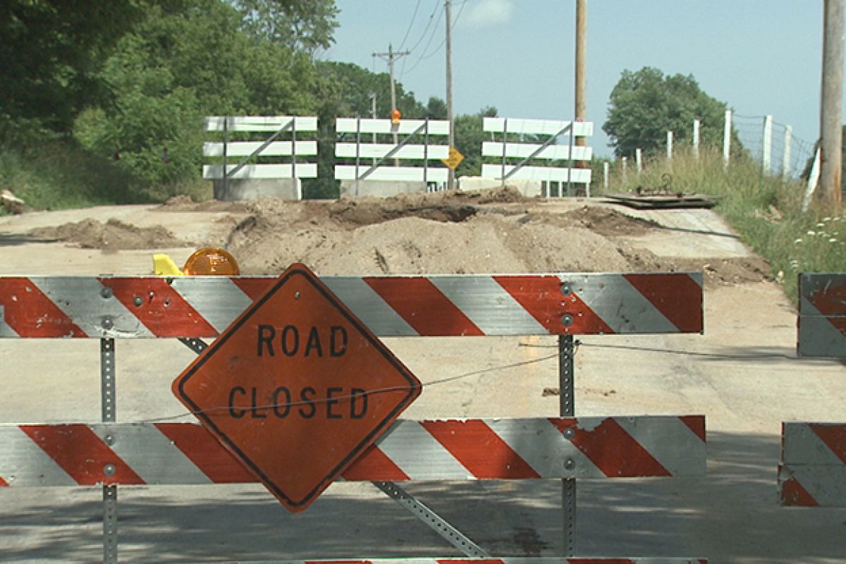 Image of a "Road Closed" sign on a road.