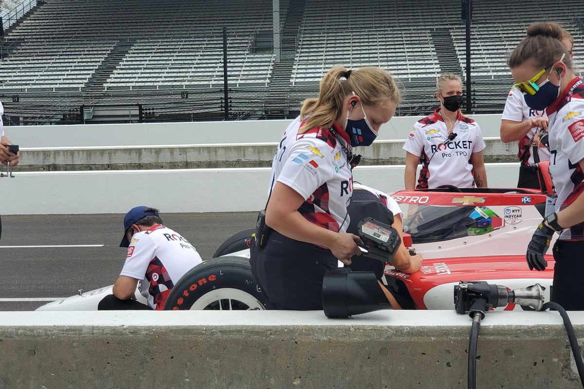 Paretta Autosport crew members work on the no. 16 car during a practice session ahead of this year's Indianapolis 500.
