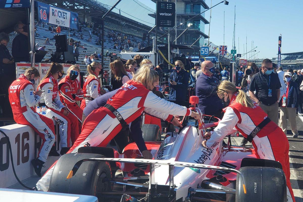 Paretta Autosport crew members prepare the car ahead of the 105th running of the Indianapolis 500. 