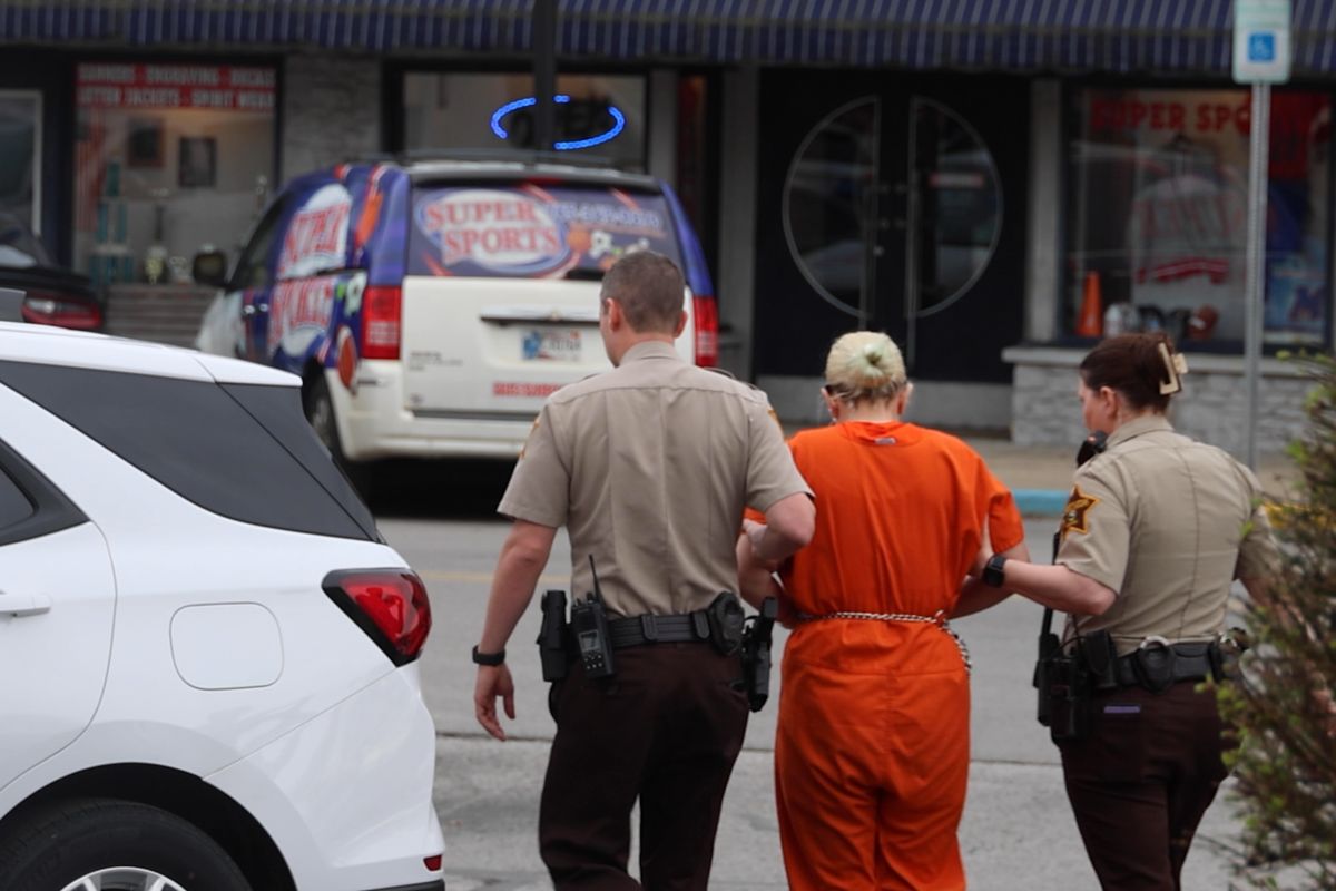 Brittany Fortinberry guided to a Morgan County Jail transport vehicle.