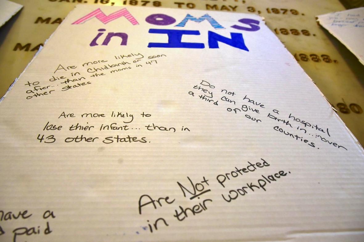 A poster advocating for better policies for women from a Hoosier Action statehouse rally during the 2021 legislative session.