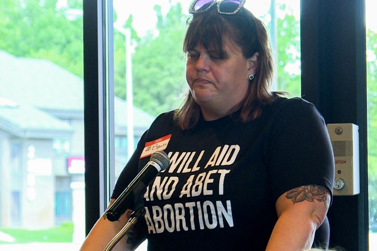 woman speaking at abortion event