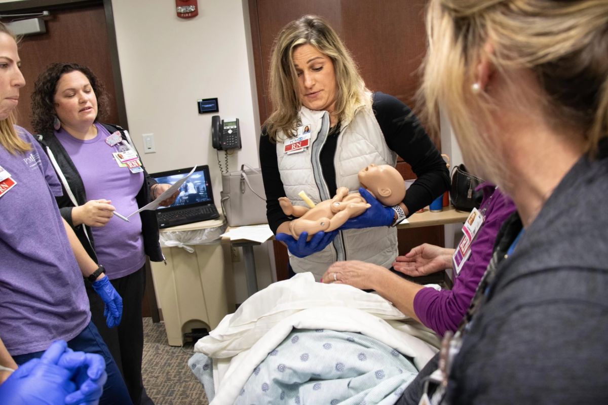 Perry County Memorial Hospital RN Bev Wilson "delivers" her first baby during a simulation team scenario in mid November.
