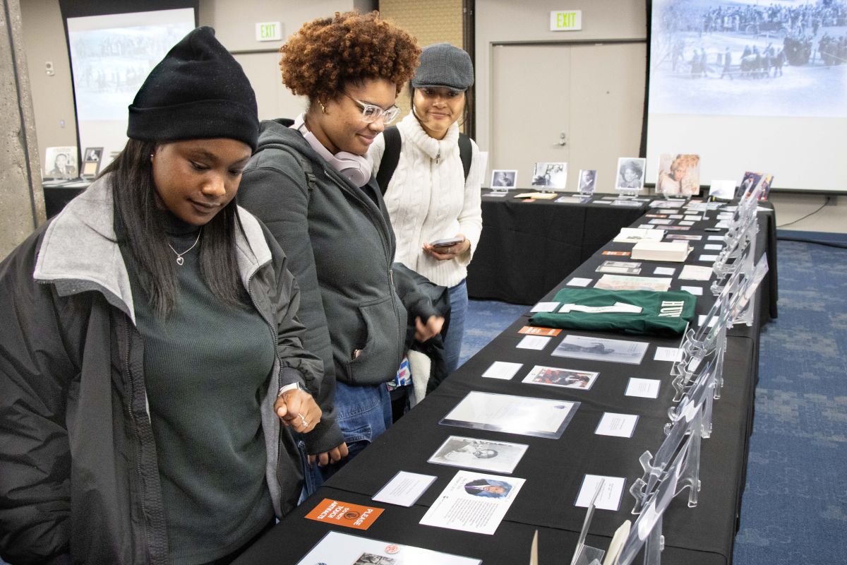 USI students from left, are Francine Salmon, Nautica Whatley and Jasmine Roland look at the True Black History Museum display at the University of Southern Indiana (USI) Tuesday, Feb. 11.