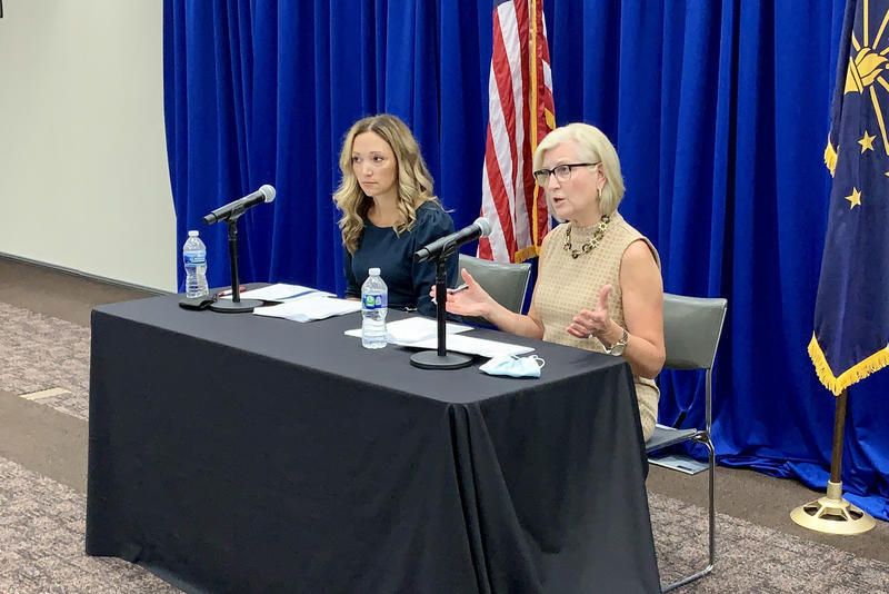 State Health Commissioner Dr. Kris Box, right, speaks at a press conference in August 2021. Dr. Lindsay Weaver, Indiana Department of Health chief medical officer, sits next to her. The governor's office announced announced Friday, May 12, Box would 