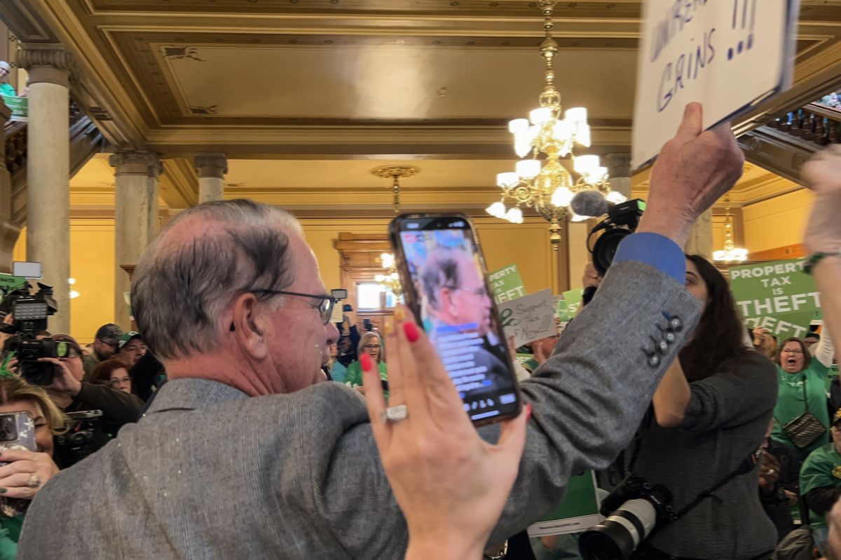 Gov. Mike Braun waded into a crowd rallying at the Statehouse to speak about property tax relief on March 17, 2025. 