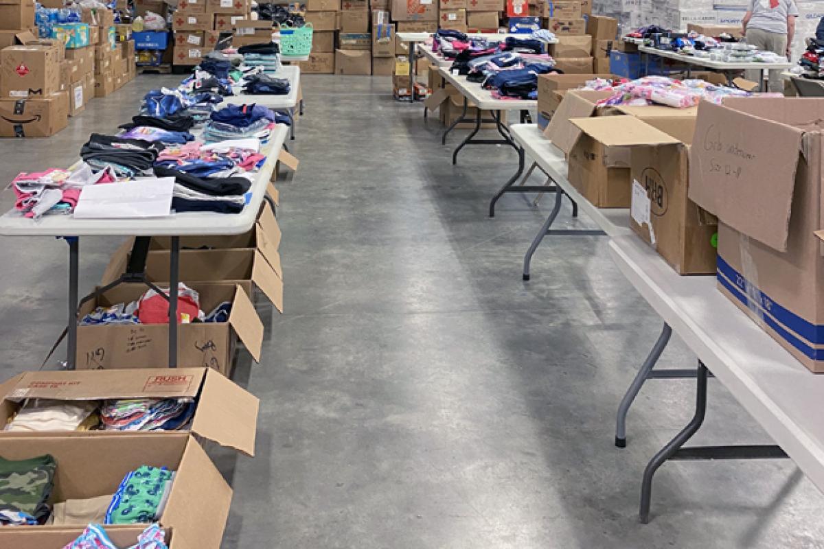 Camp Atterbury warehouse full of items for refugees.
