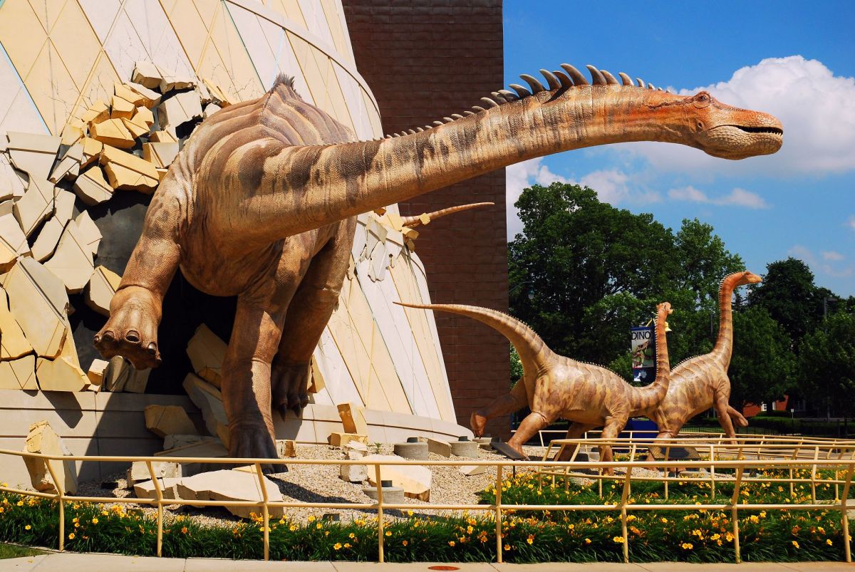 Dinosaurs appear to breakout of the facade of the Indianapolis Children's Museum in Indiana