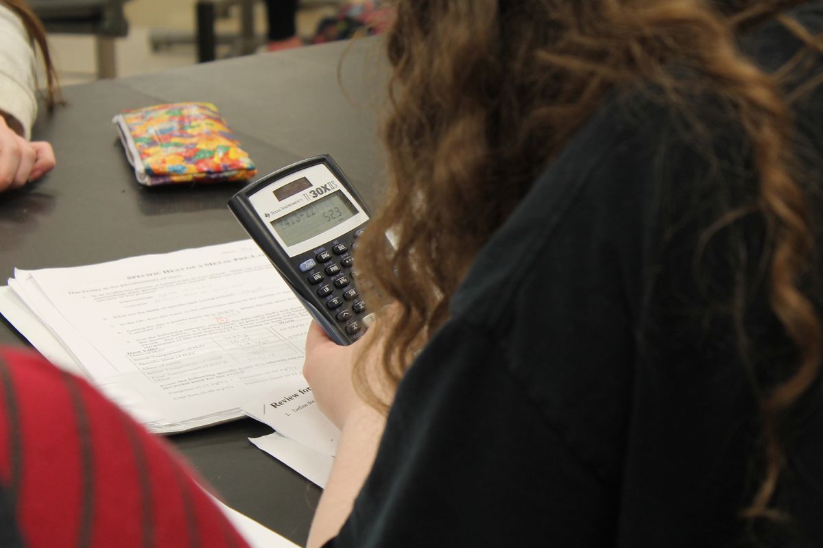 A student uses a calculator in class.