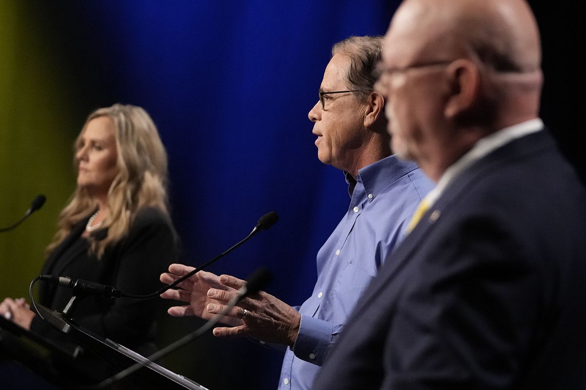 Republican candidate U.S. Sen. Mike Braun (R-Ind), middle, speaks during a debate for Indiana governor hosted by the Indiana Debate Commission at WFYI on Thursday, Oct. 24, 2024, in Indianapolis.