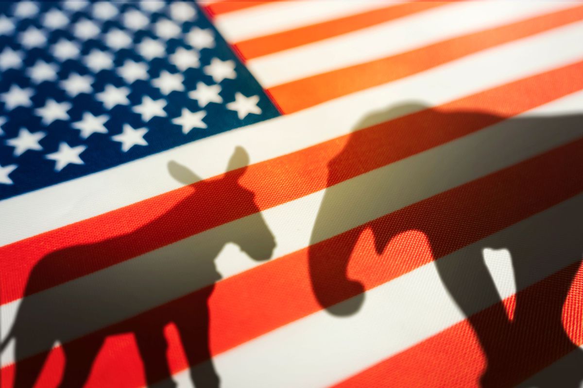 Democrat Republican animal shadows on the flag. Democrats vs republicans are in ideological duel on the american flag. In American politics US parties are represented by either the democrat donkey or republican elephant