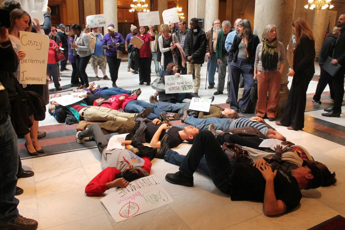 During a 2018 demonstration, protesters gather in front of Gov. Eric Holcomb's office as part of a "die in."