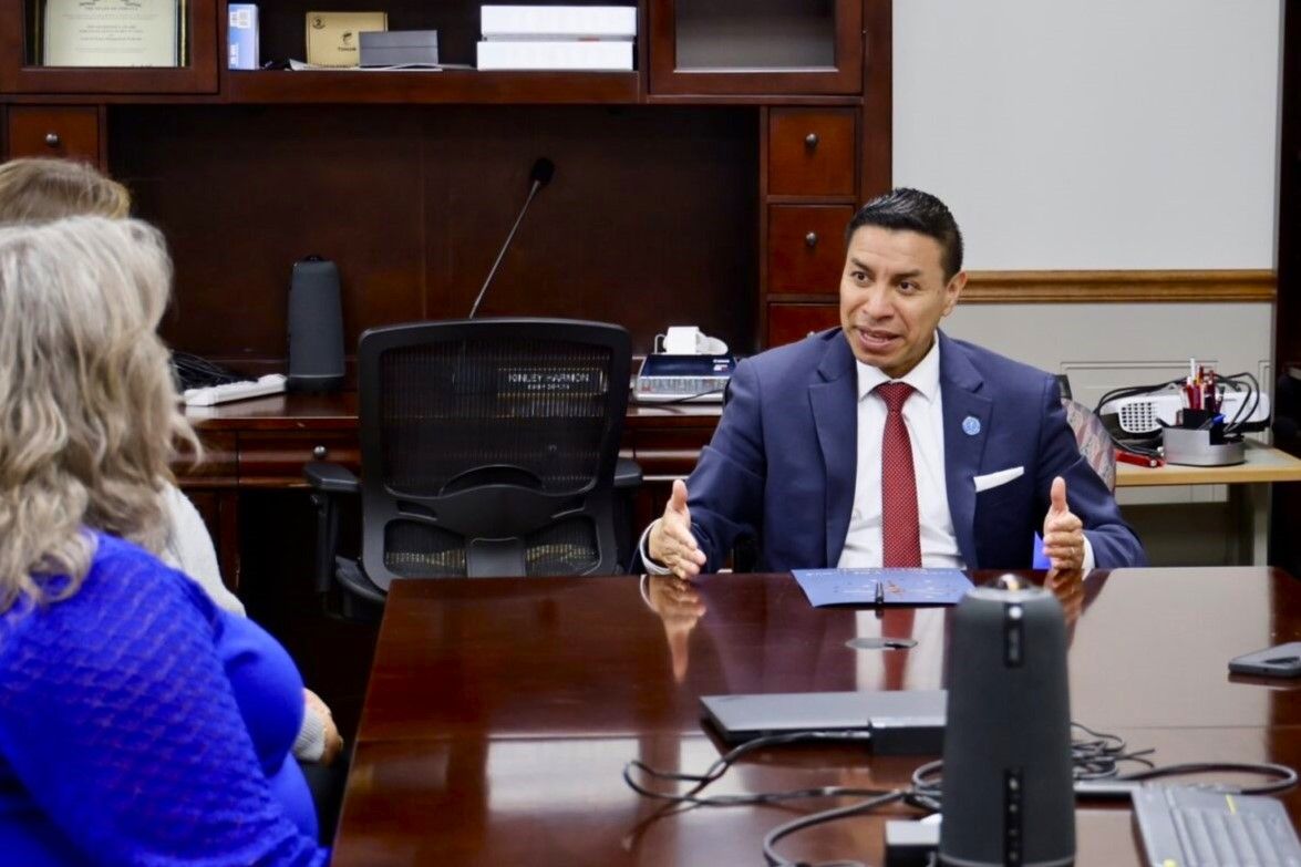 Indiana Secretary of State Diego Morales, center, meets with Scott County leaders in February 2025.