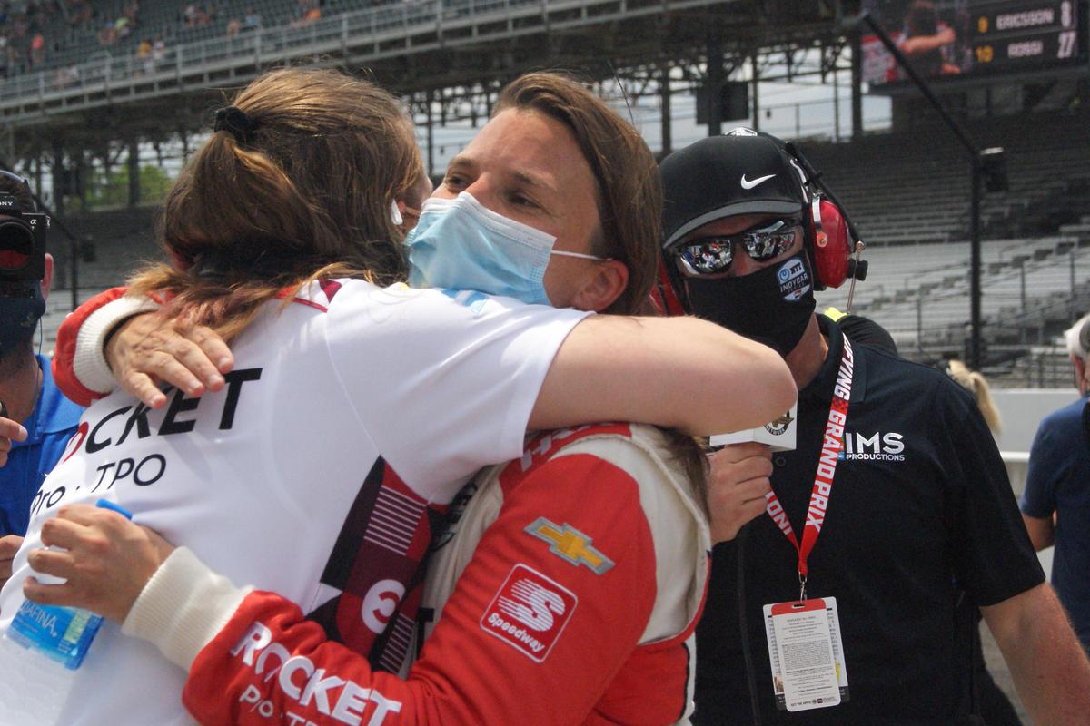 Driver Simona de Silvestro hugs one of her Paretta Autosport teammates after qualifying for the Indianapolis 500.