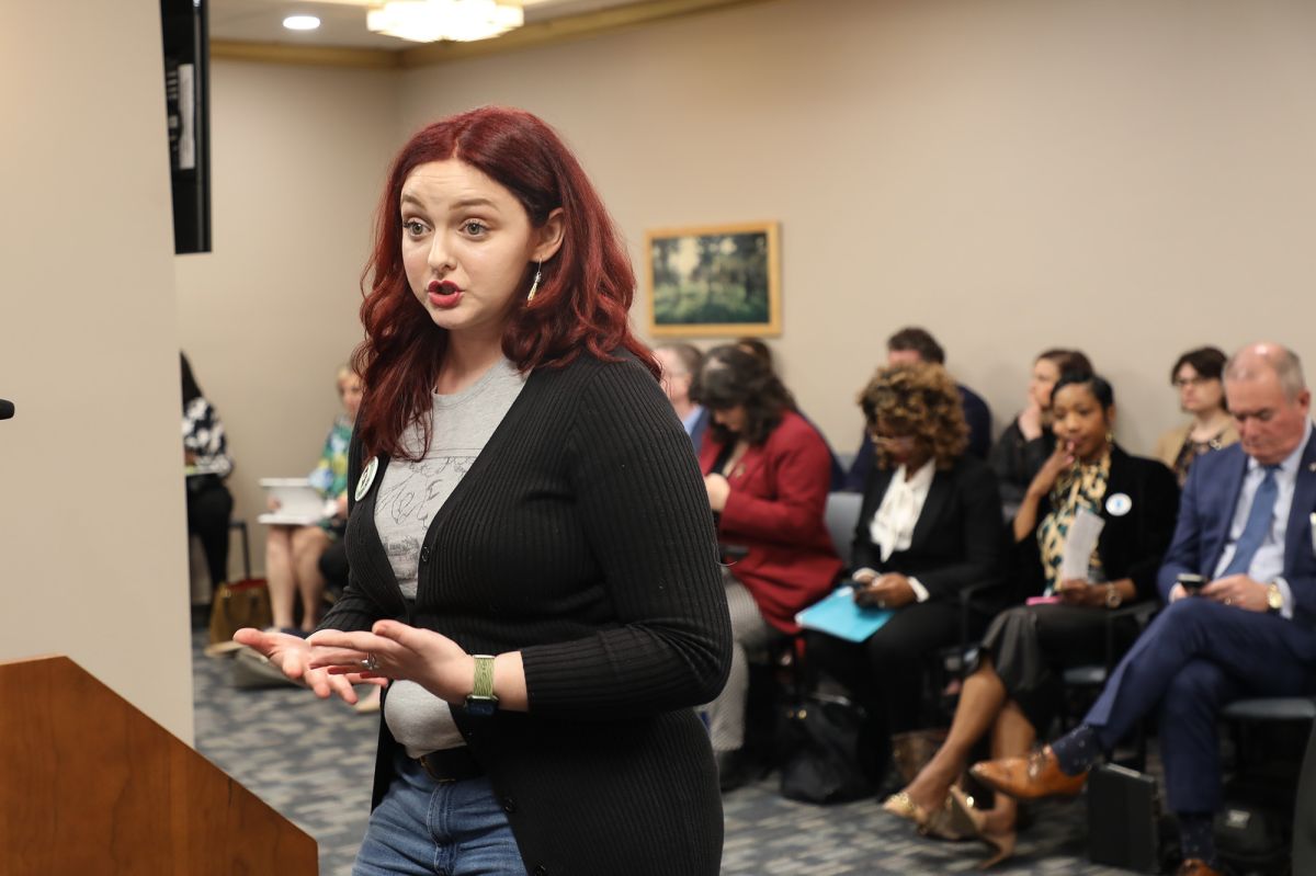 woman speaking at a podium