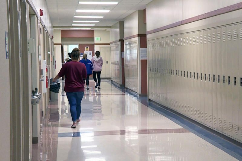 A student walks in down a hallway in Franklin High School.
