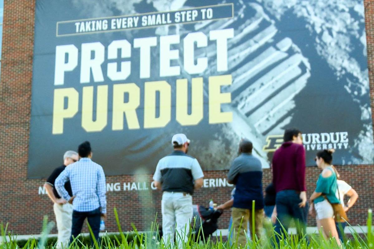 Prospective candidates for Purdue's remote worker program take a tour of the campus. 