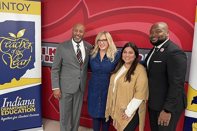 teacher of the year posing for photo with Indiana's secretary of education