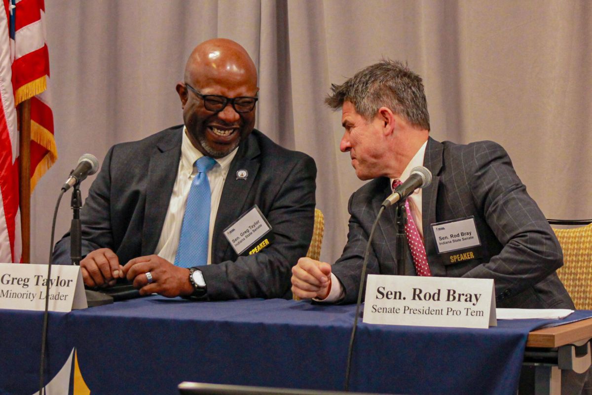 Senate Minority Leader Greg Taylor (D-Indianapolis) and Senate President Pro Tem Rodric Bray (R-Martinsville) talk during a panel discussion hosted by the Indiana Chamber of Commerce on Monday, Nov. 20, 2023.