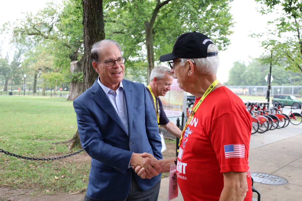 Mike Braun shaking hands with a man