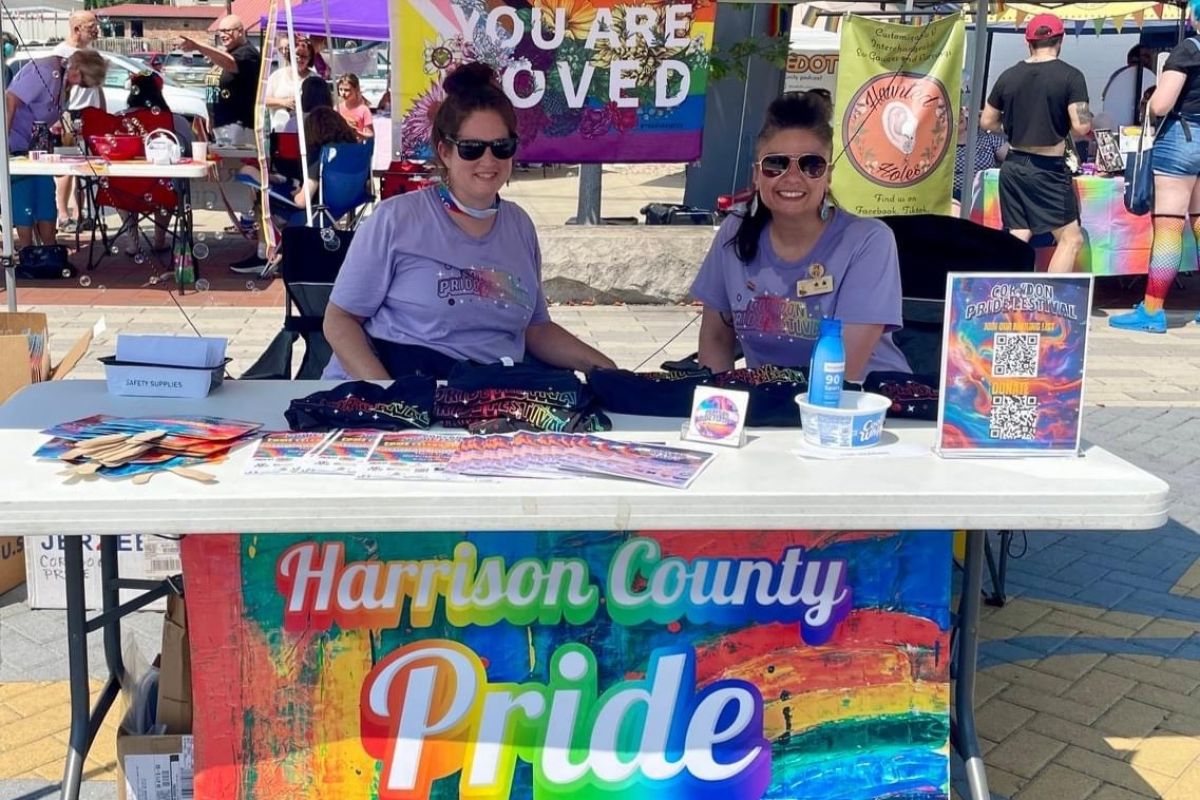 Volunteers for Harrison County Pride work a tent at a recent festival.