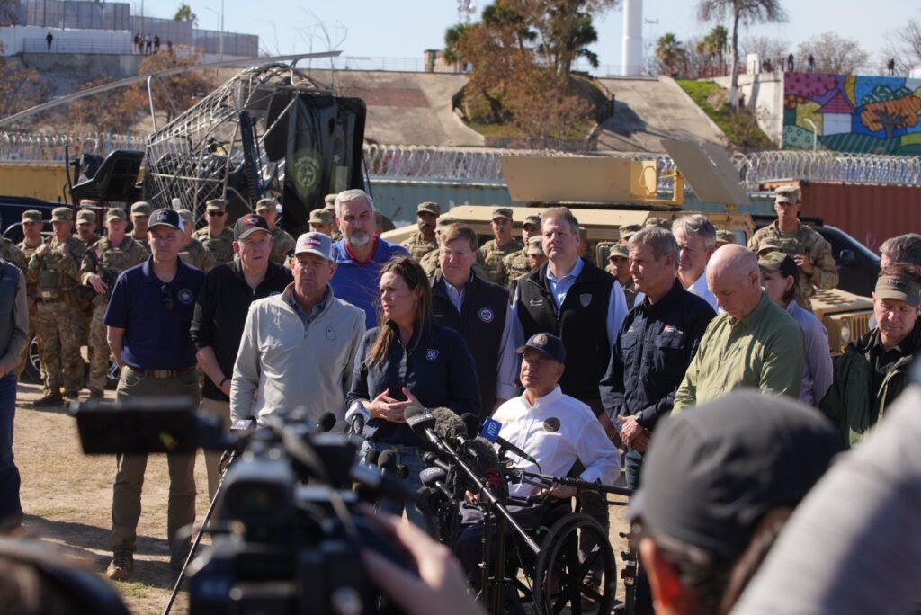 Indiana Gov. Eric Holcomb, a Republican, stands at a news conference along the U.S.-Mexico border in Texas on Sunday, Feb. 4, 2024.