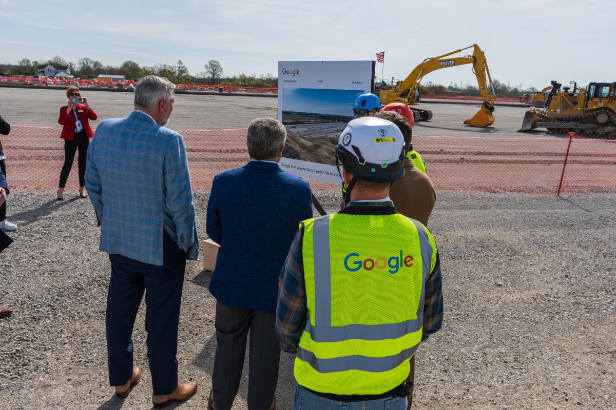 Indiana Gov. Eric Holcomb, in blue, looks at an aerial overview of Google’s data center project in Fort Wayne during an announcement and groundbreaking ceremony on April 26, 2024.