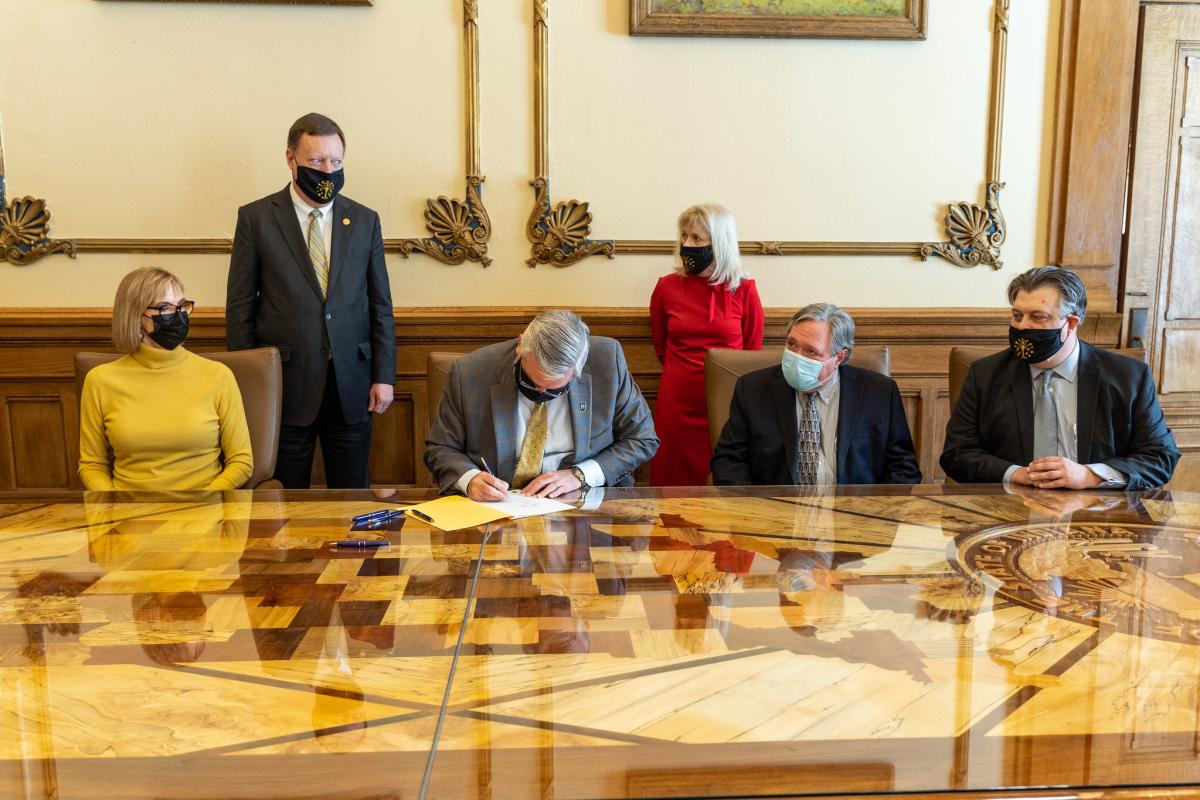 Gov. Eric Holcomb signing Senate Bill 1