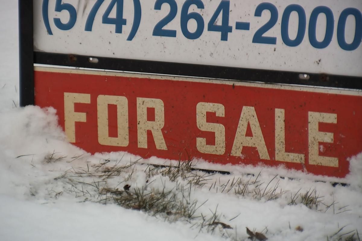 house sale sign with a northern Indiana phone number