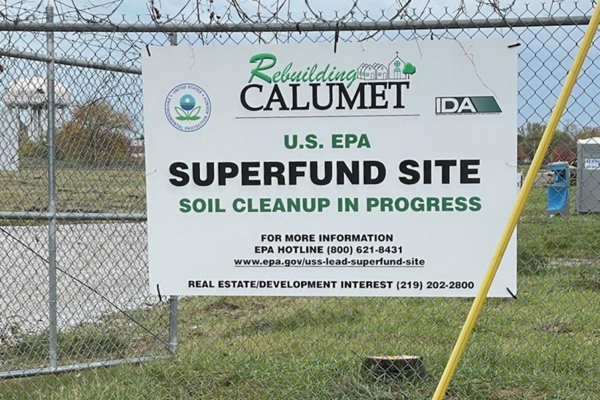 The West Calumet Housing Complex was demolished in 2018. A new sign has been posted on the wire fence surrounding the vacant land for Industrial Development Advantage, LLC