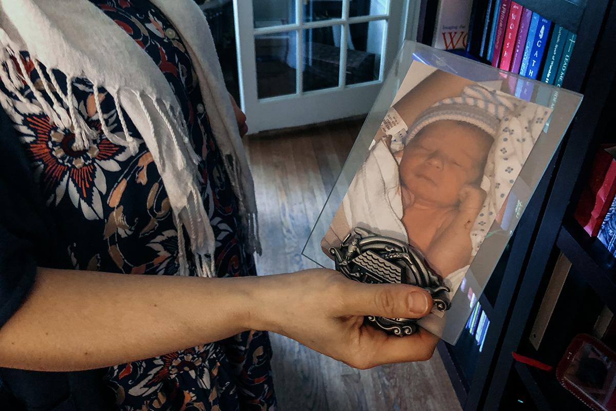 South Bend resident Meg Hartz holds a photo of her son as a baby.