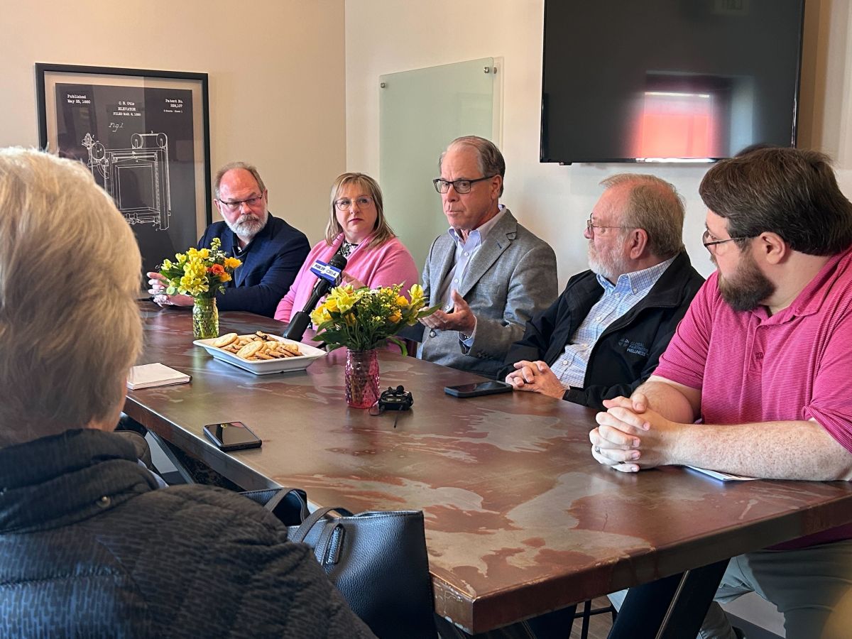 Gov. Braun sitting at a table with about 10 people