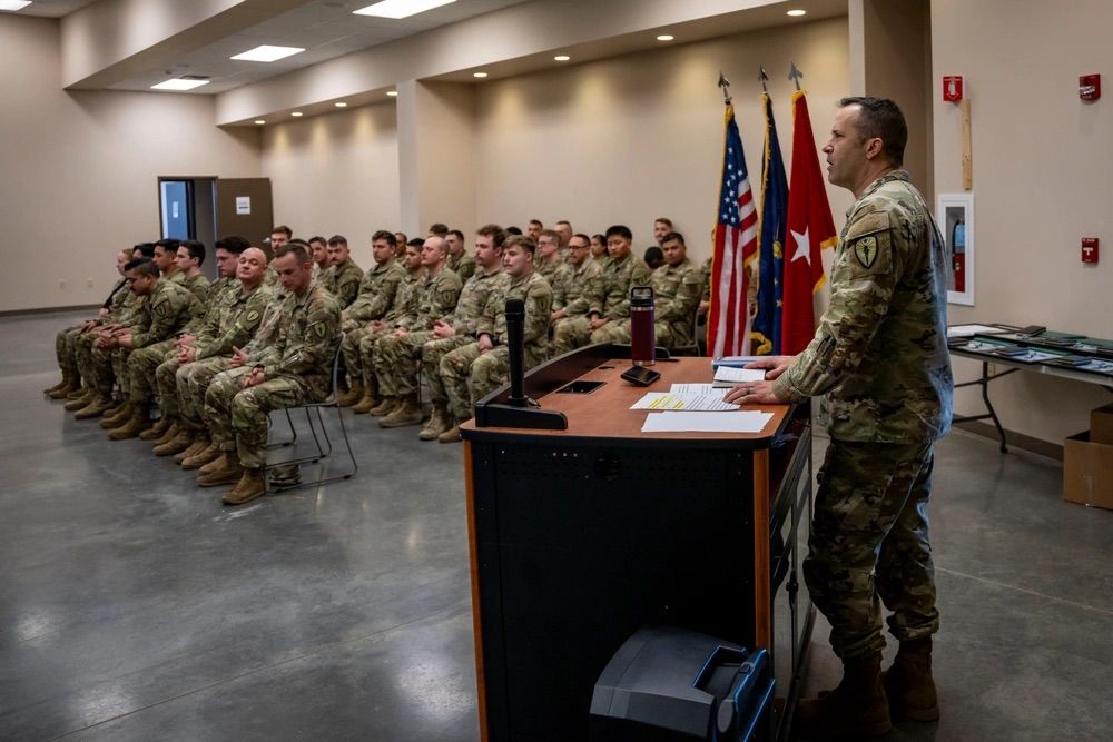  Brig. Gen. Justin Mann addresses Indiana National Guard soldiers and airmen, along with their family and friends, during an awards ceremony March 3, 2025, at Camp Atterbury near Edinburgh, Indiana. 