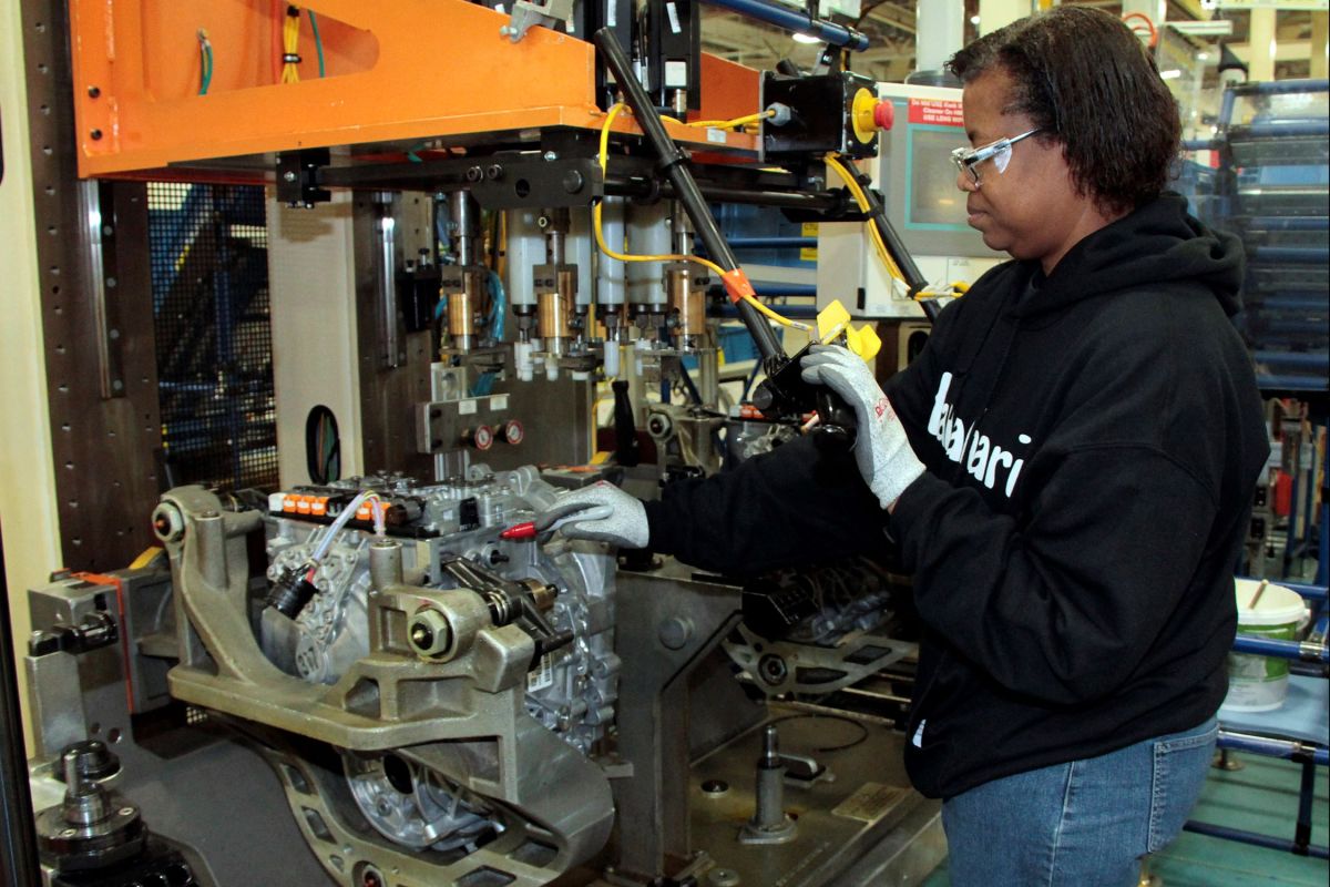 An employee at Stellantis' Indiana Transmission Plant in Kokomo works to produce a nine-speed transmission.