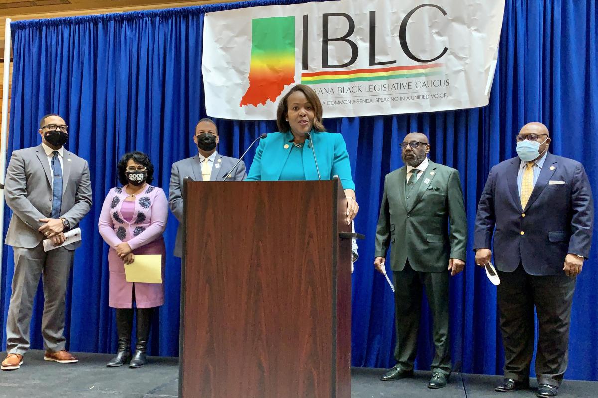 Indiana Black Legislative Caucus Chair Robin Shackleford (D-Indianapolis), center, is flanked by House Speaker Todd Huston (R-Fishers), left, and House Democratic Leader Phil GiaQuinta (D-Fort Wayne), right.