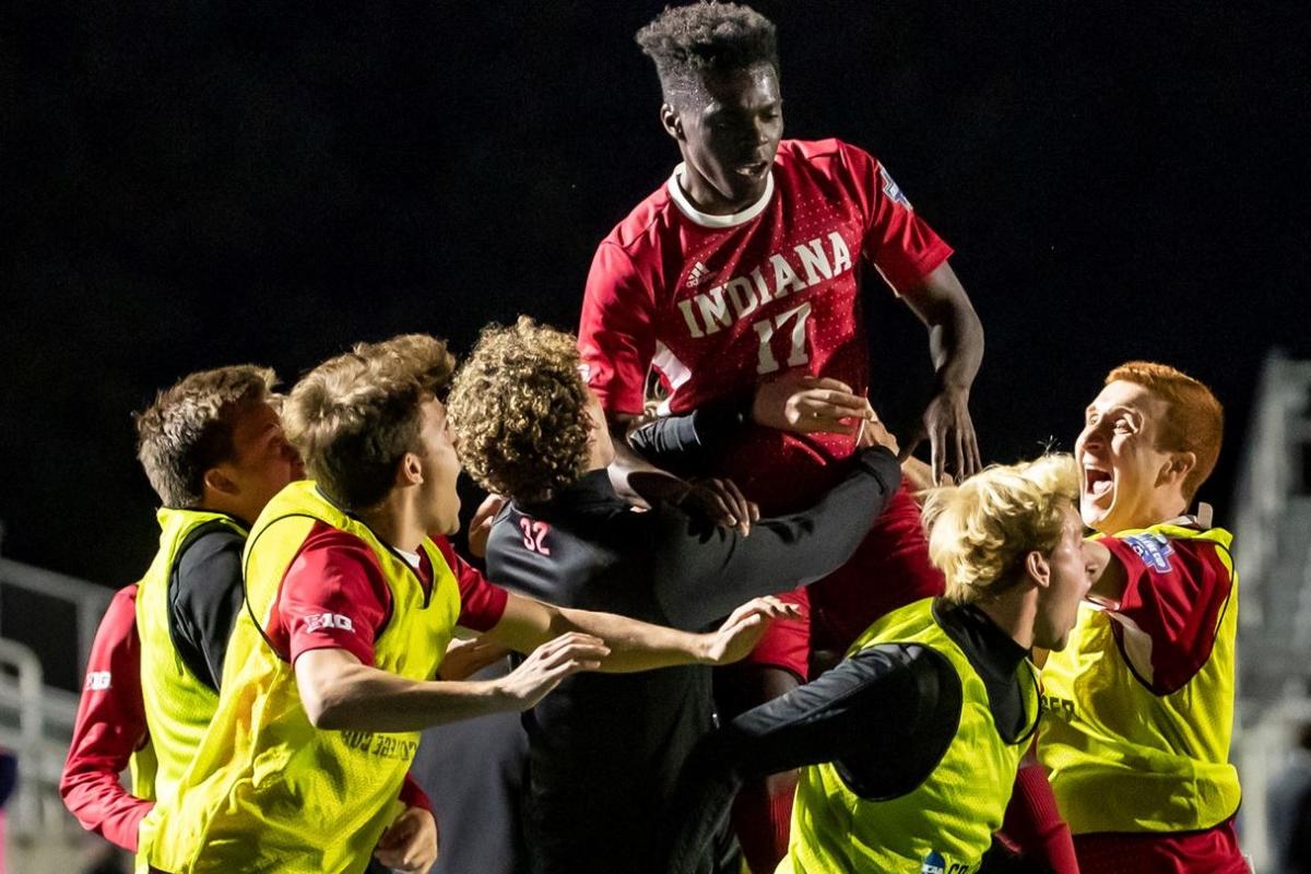 Indiana's Herbert Endeley is hoisted by teammates after scoring against Pitt in the NCAA soccer semifinals Friday night.