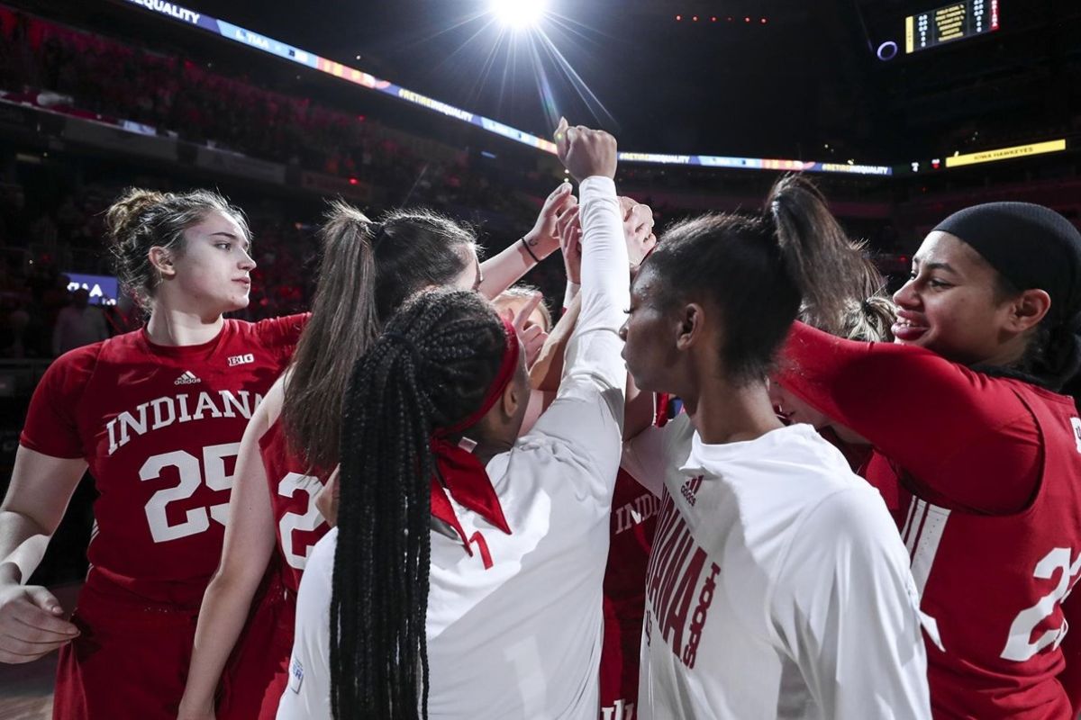 The Indiana women's basketball team huddles before the Big Ten Tournament championship game.