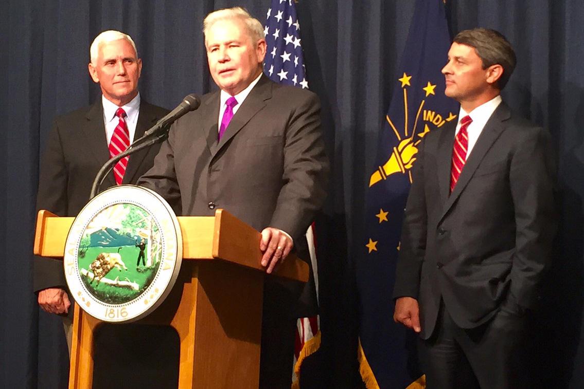 Jim Schellinger, center, was named the head of the Indiana Economic Development Corporation in 2015 by then-Gov. Mike Pence, left.