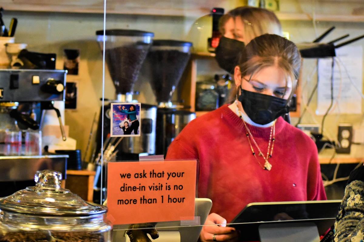 A young worker takes orders at the Blackbird Cafe in Valparaiso.