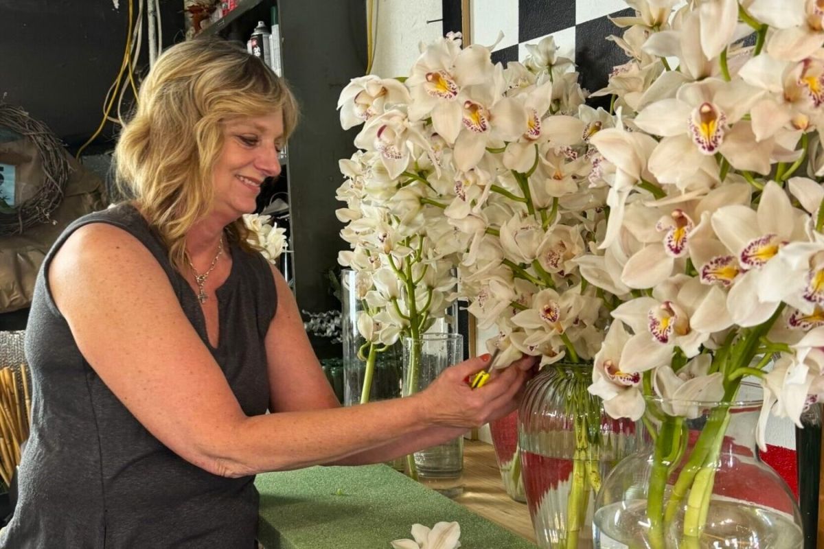 Julie Harman Vance of Buck Creek in Bloom tends to the orchids that will make up this year's Indy 500 victory wreath.