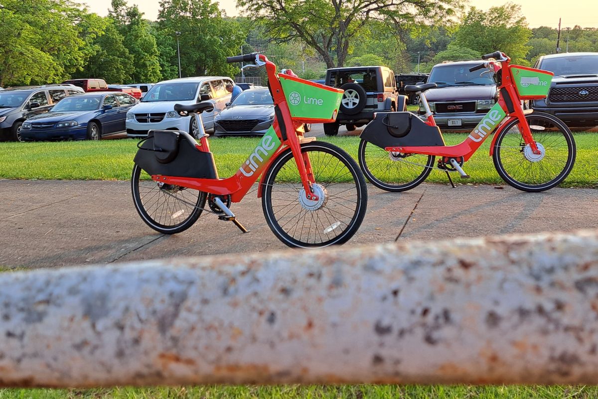 Lime e-bikes can be found all around town for use, like at Bloomington High School North.