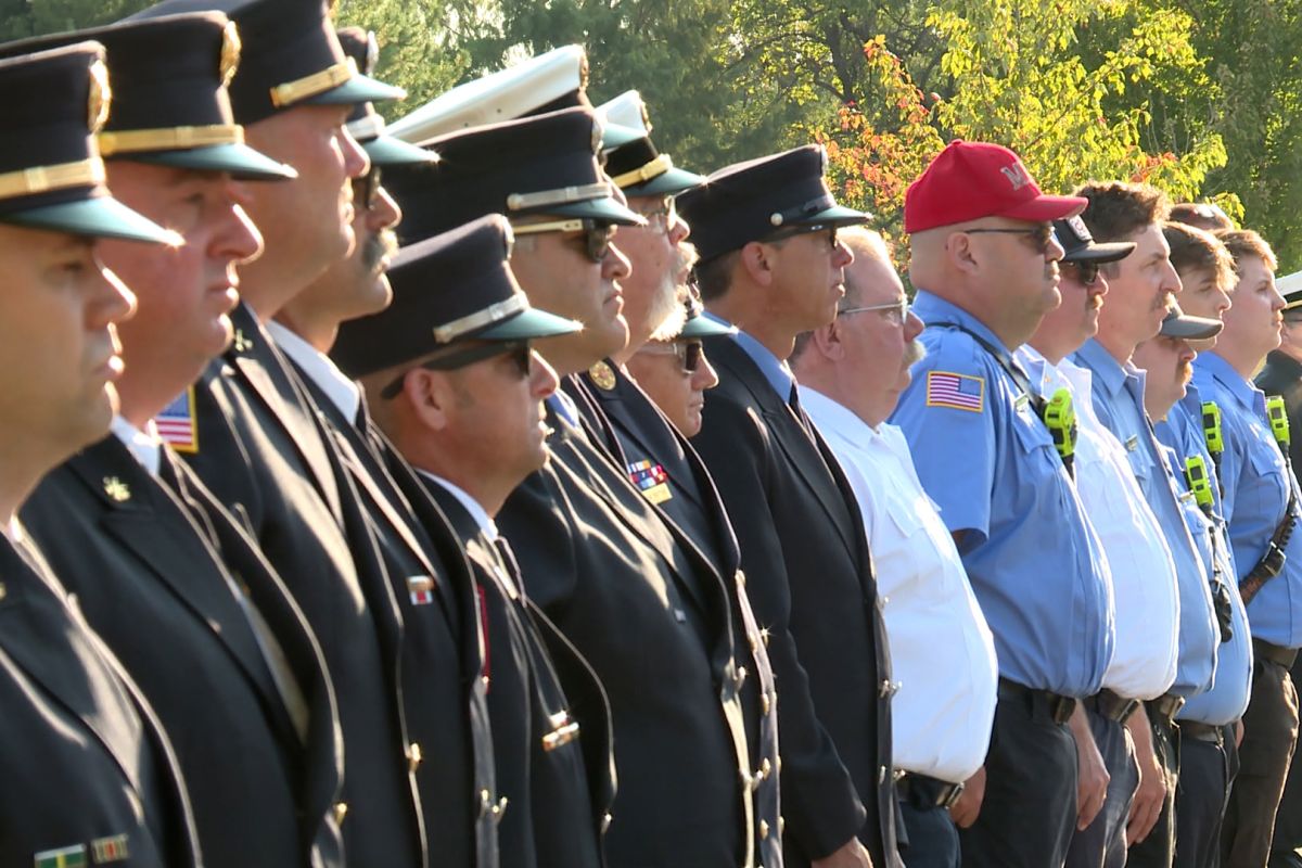 A line of first responders at the 9/11 ceremony.