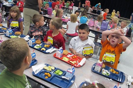 First graders at Wea Ridge Elementary in Lafayette eat lunch on Thursday, Aug. 16, 2012. Schools in Indiana and across the country are changing what they're serving to meet new federal school lunch guidelines.