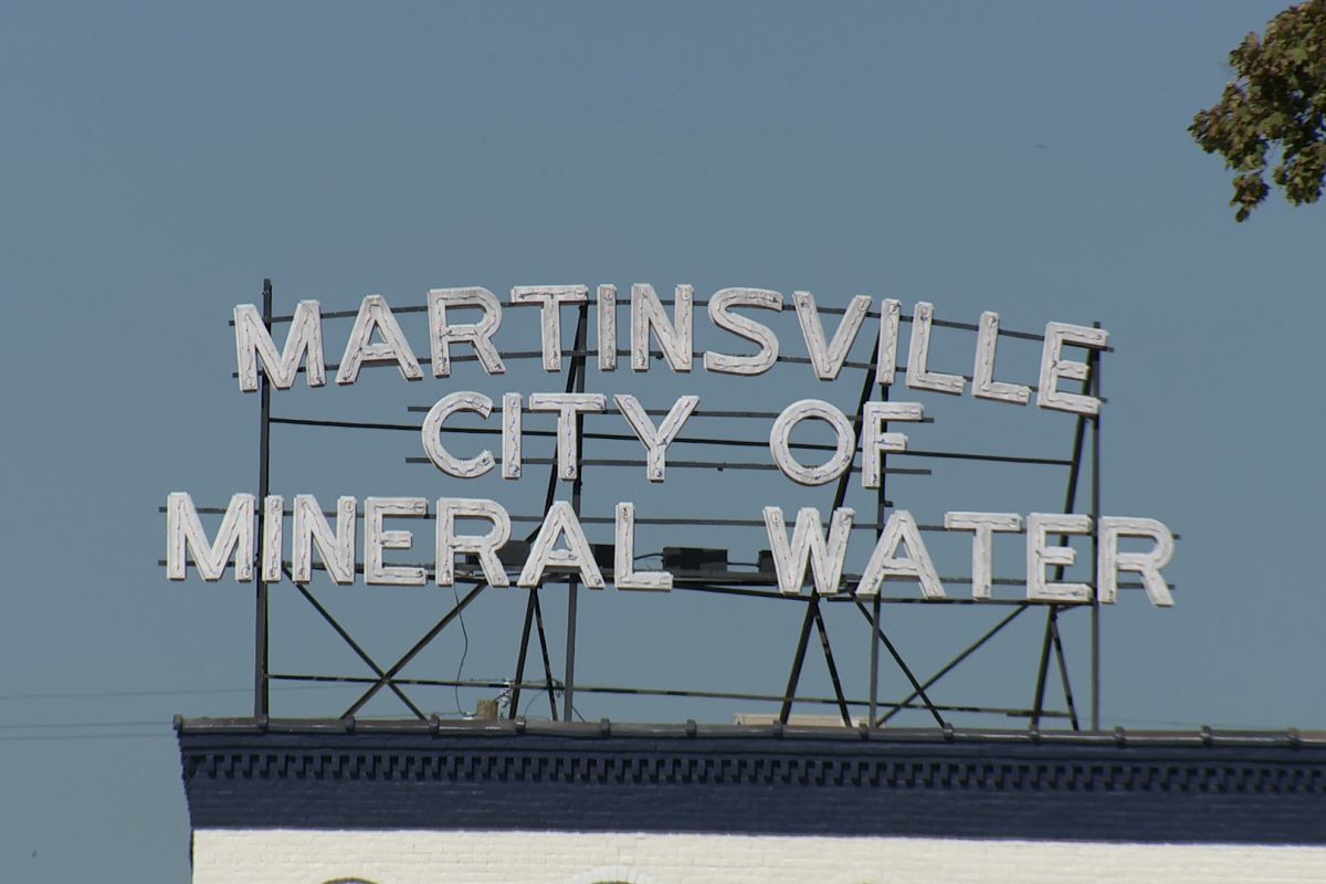 The sign for the city of Martinsville which reads "Martinsville: City of Mineral Water"