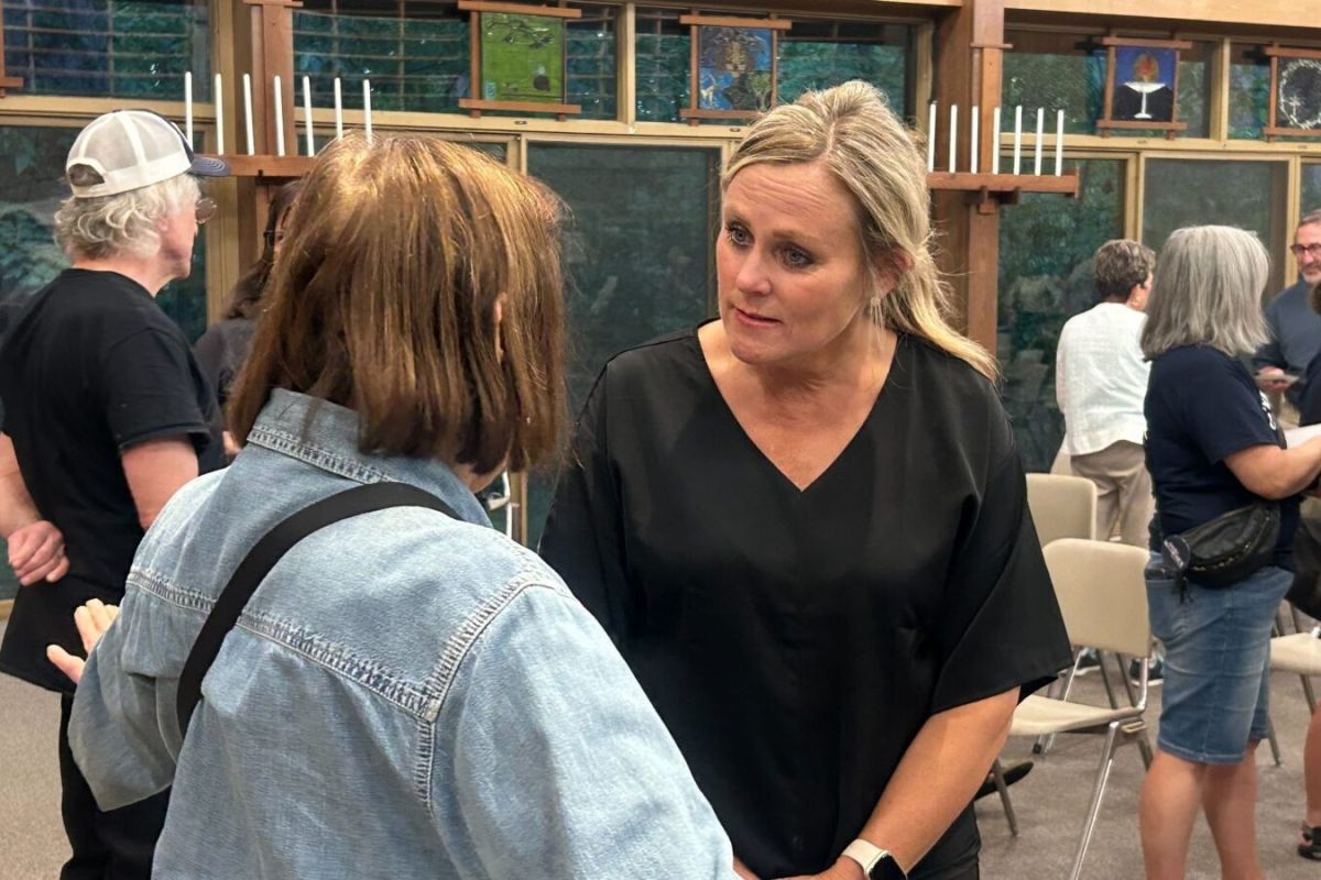 Jennifer McCormick speaks with a supporter after a town hall.